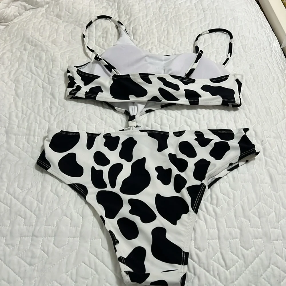 NWOT Black and white asymmetric swimsuit size L.